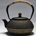 Japanese cast iron teapot with traditional pattern and 0.9L capacity for tea brewing