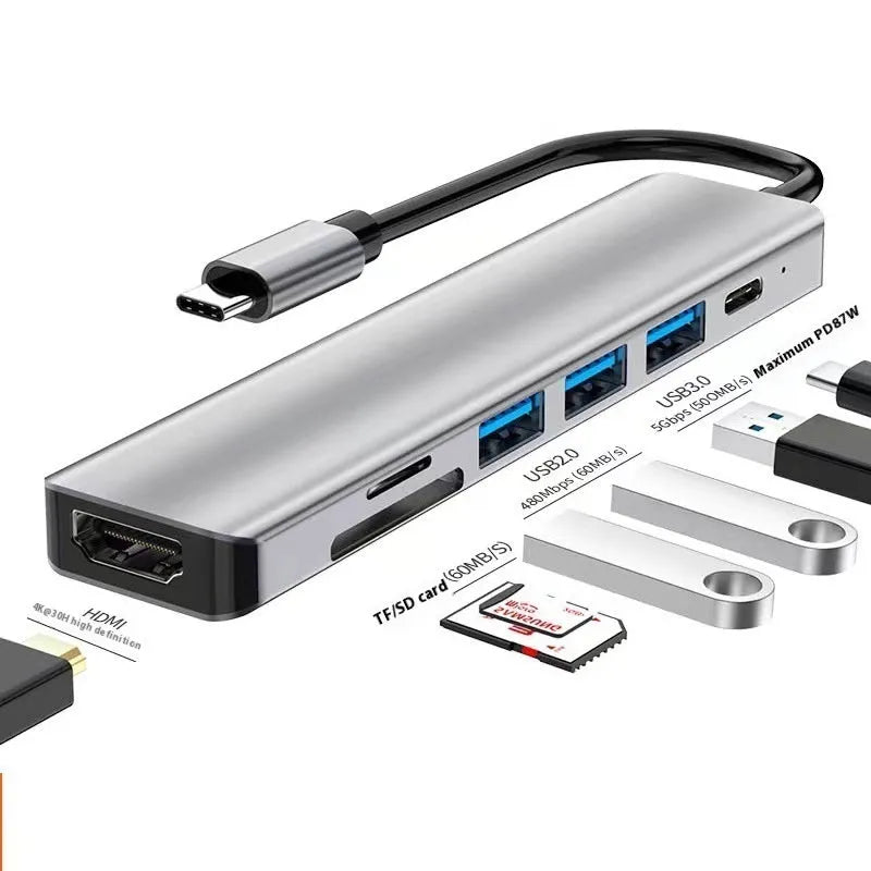 Silver aluminium USB-C 7-in-1 expansion dock with HDMI, VGA, USB 3.0 ports, and a 15cm cable