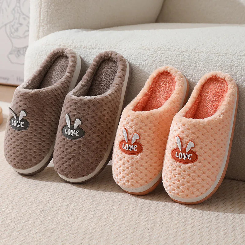 Women's rabbit plaid design artificial fur slippers with a thick rubber sole in various colours.