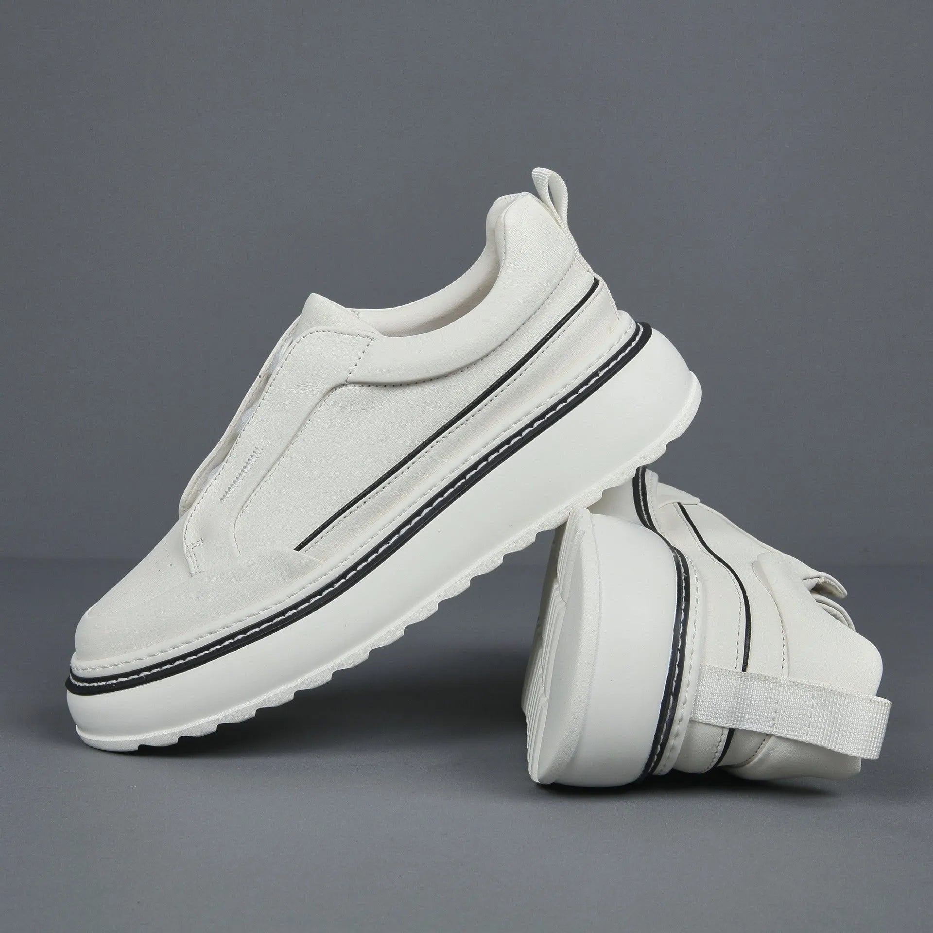 Women's black casual slip-on sneaker with cowhide upper, foam platform sole, round toe, and elastic band