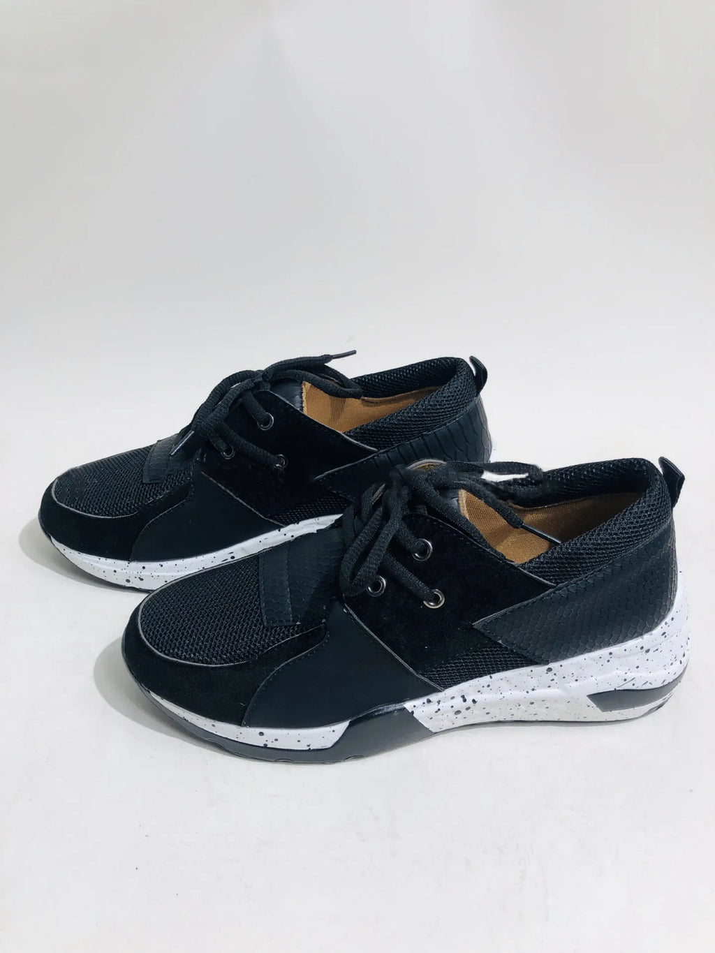 Women's casual suede sneakers with a wedge heel in black, leopard, pink, panther, and snake pattern colours.
