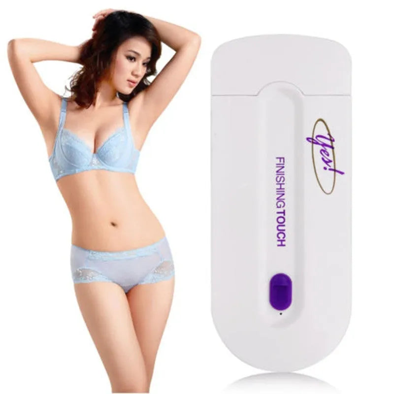 Silver electric hair removal shaver with USB charger cord, trimmer head, foil head, and cleaning brush on a white background.