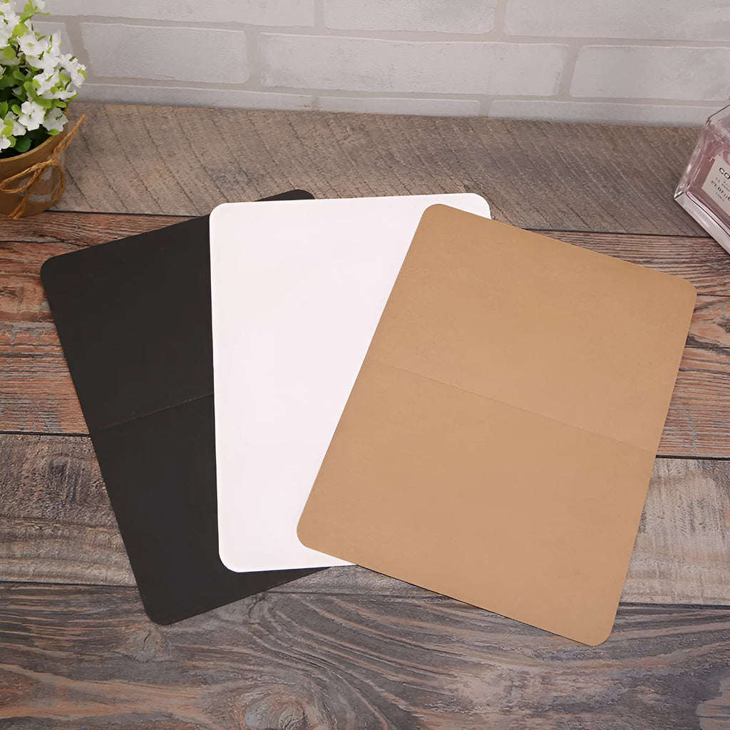 Pack of 100 folded kraft cards in 10x15 cm size, showing black, cowhide, and white colour options.