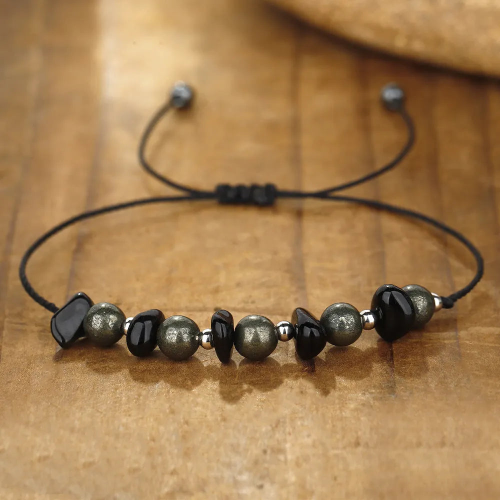 Black stone beaded bracelet with geometric garnet gravel beads and moon design element