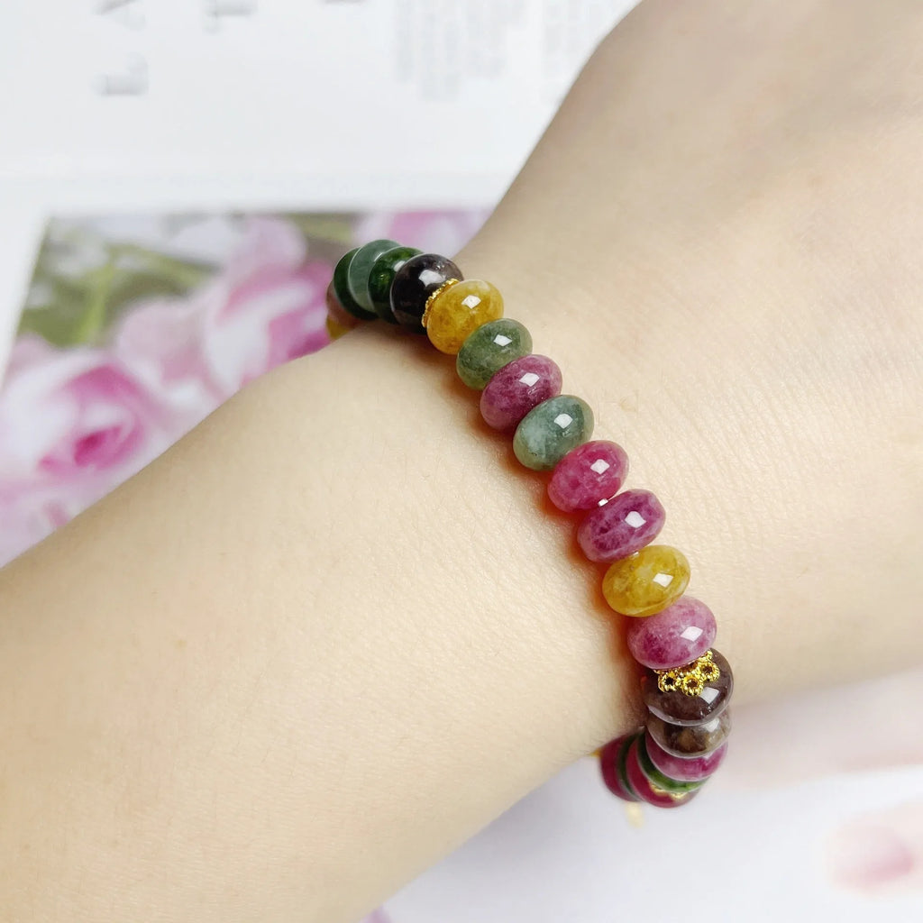 Colourful artificial crystal abacus bead bracelet with tourmaline-style stones on wrist
