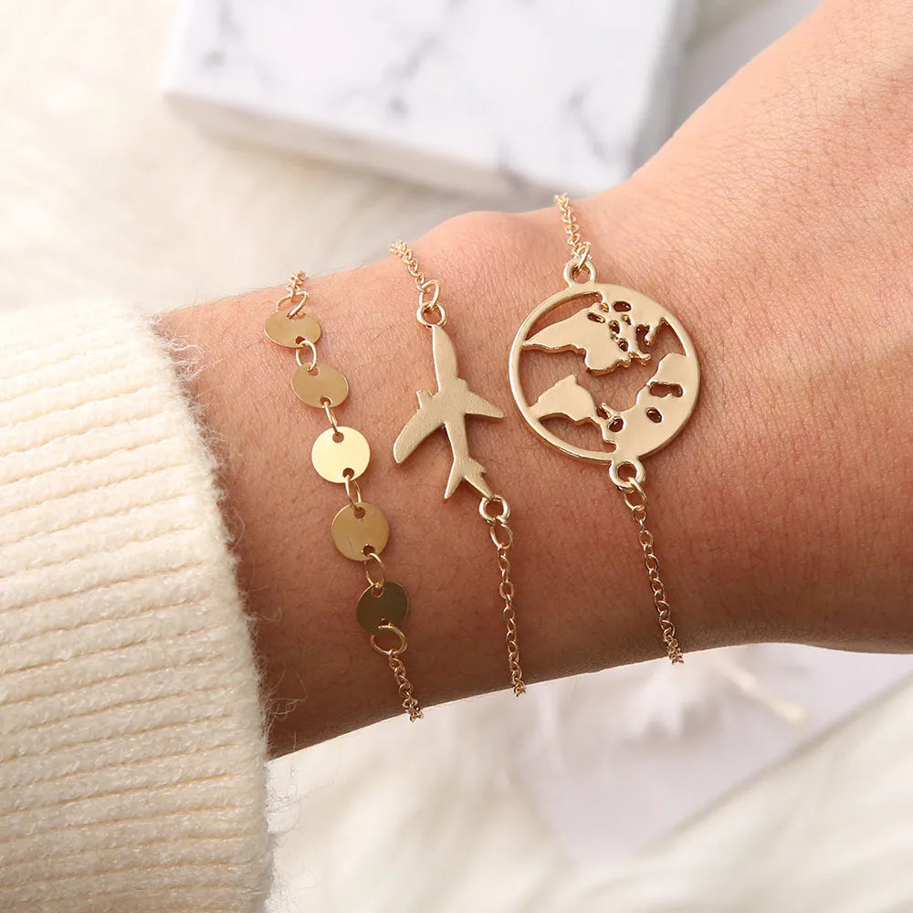 Three bohemian bracelets with heart-shaped aircraft map charms in sku2104 colour