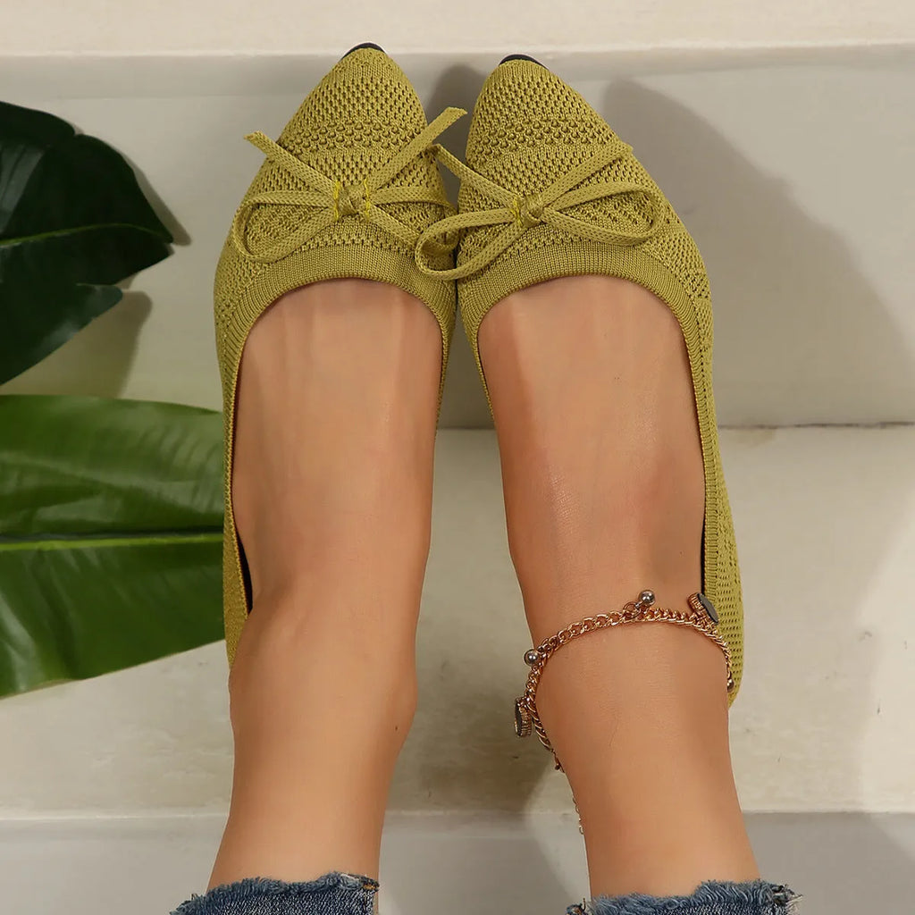 Women's knitted flat shoes with a pointed toe and decorative bow, shown in multiple colour options.