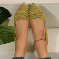 Women's knitted flat shoes with a pointed toe and decorative bow, shown in multiple colour options.