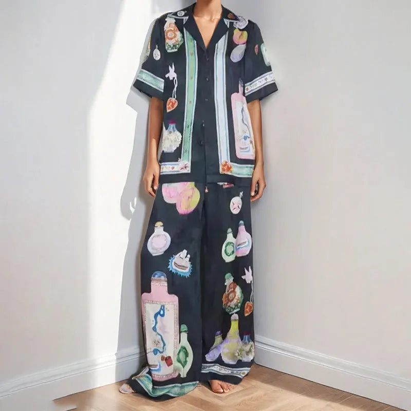 Black women's casual set with cartoon print, featuring a sleeve cardigan and trousers