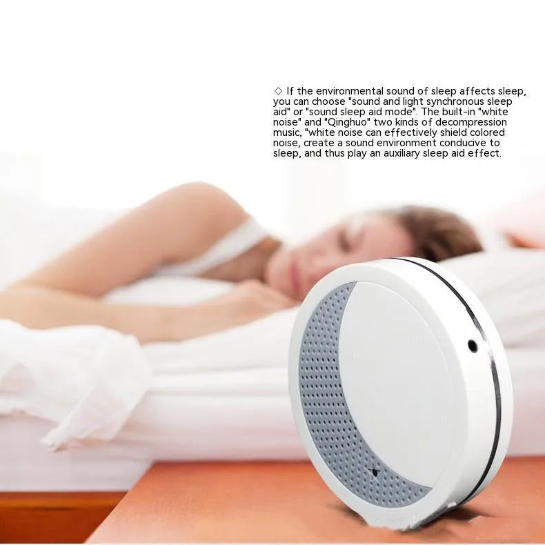 White ABS plastic sleep aid instrument with USB connector showing timer and music functions