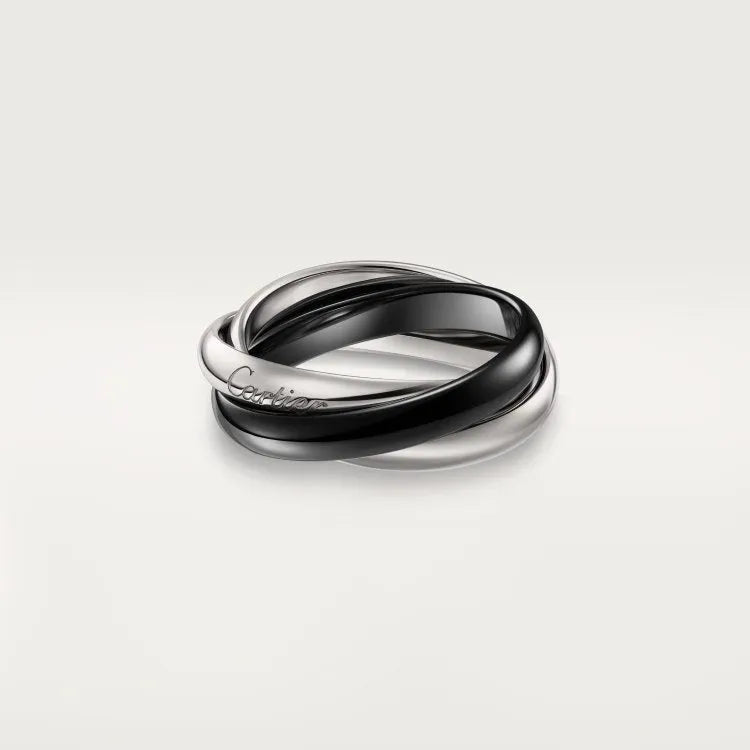 A geometric U-shaped silver couple ring fully set with diamonds on a black background.