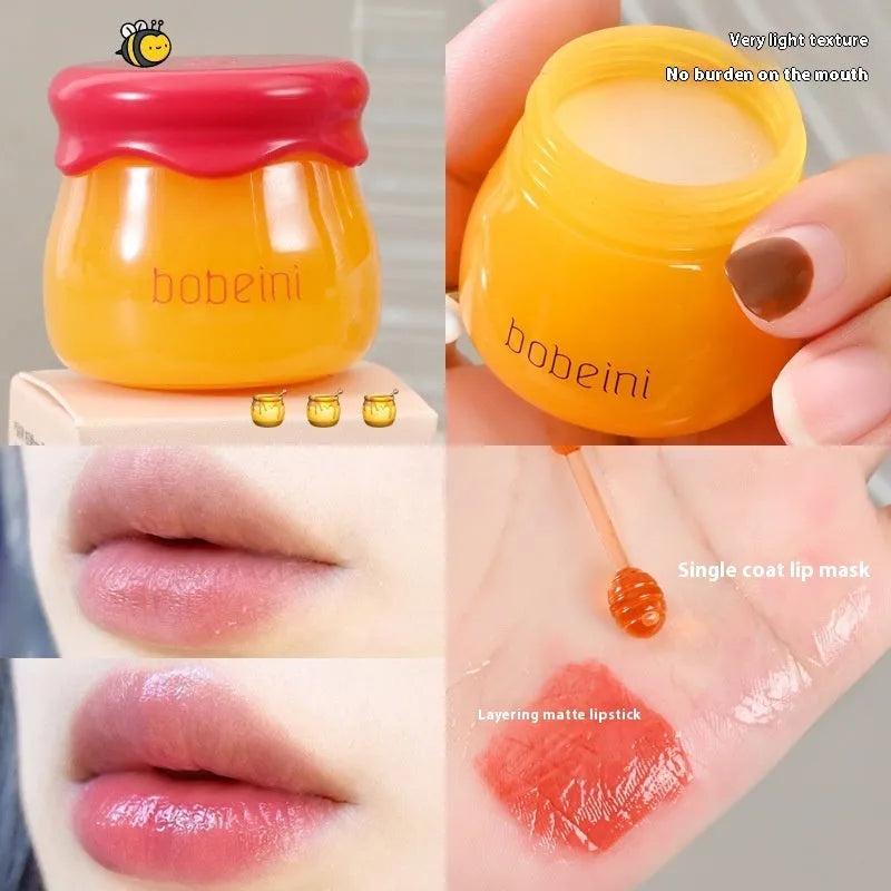Vaseline lip balm in 9g honey pot with small brush applicator in pomegranate or blueberry flavour
