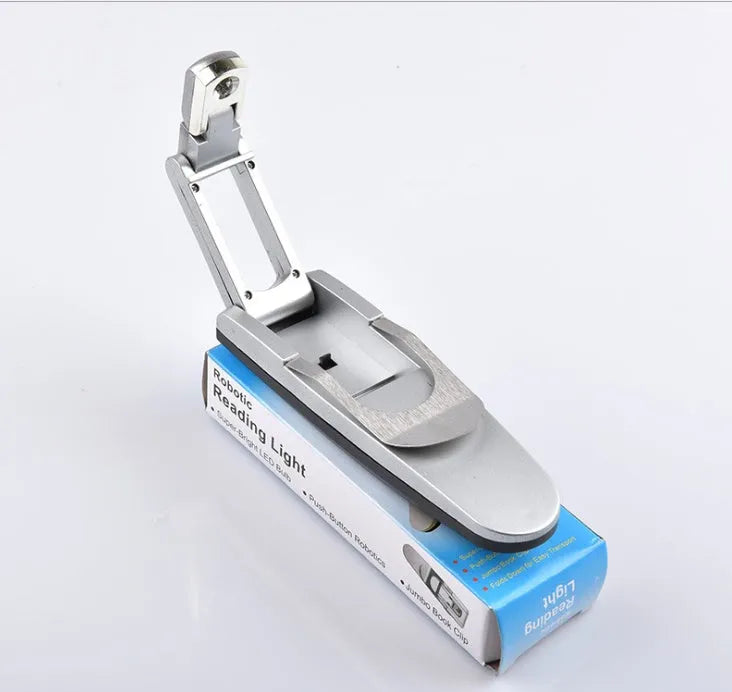 Folding book light in plastic and stainless steel, compact 12cm clip-on reading light for books and e-readers