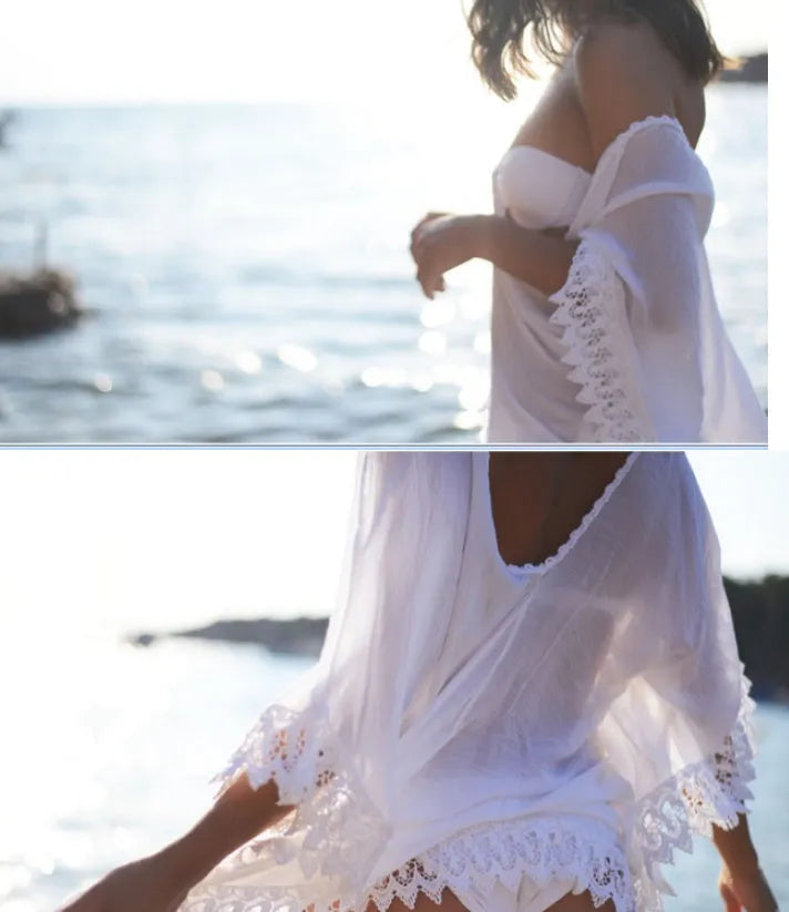 Tasselled beach coverup in cotton blend with loose fit and fringe trims on sleeves and hem