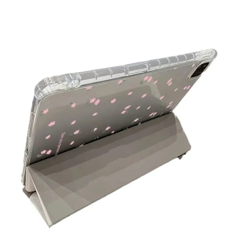 Transparent floral tri-fold iPad case showing magnetic stand function and clear polycarbonate construction