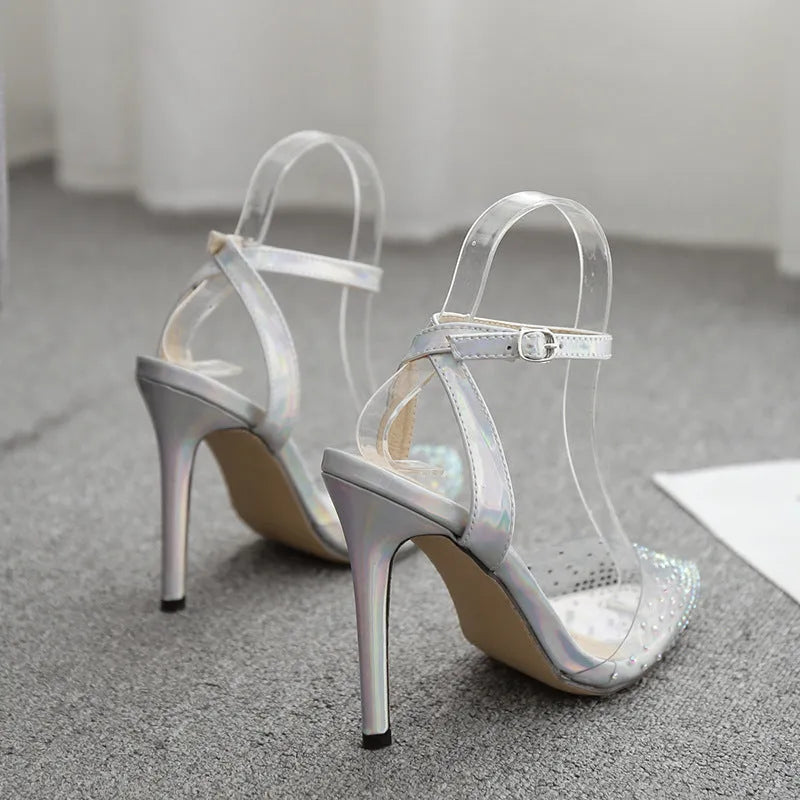 Women's pointed-toe sandals with diamond decoration and a thin stiletto heel.
