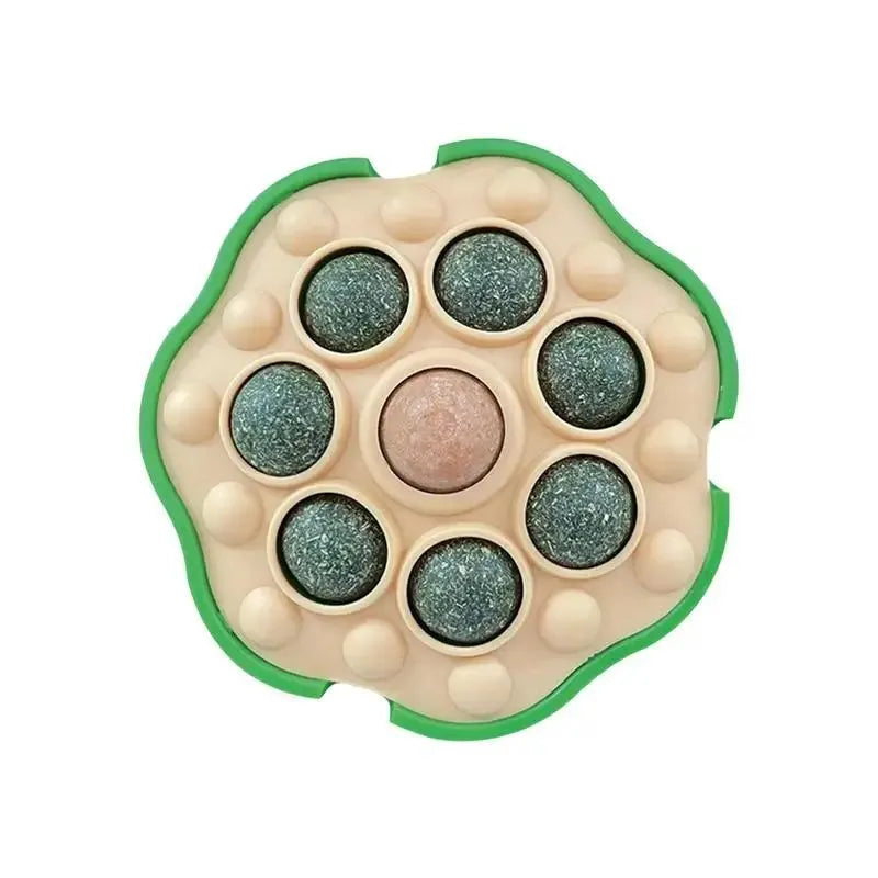 Green lotus-shaped catnip ball with stick-on wall backing for indoor cats