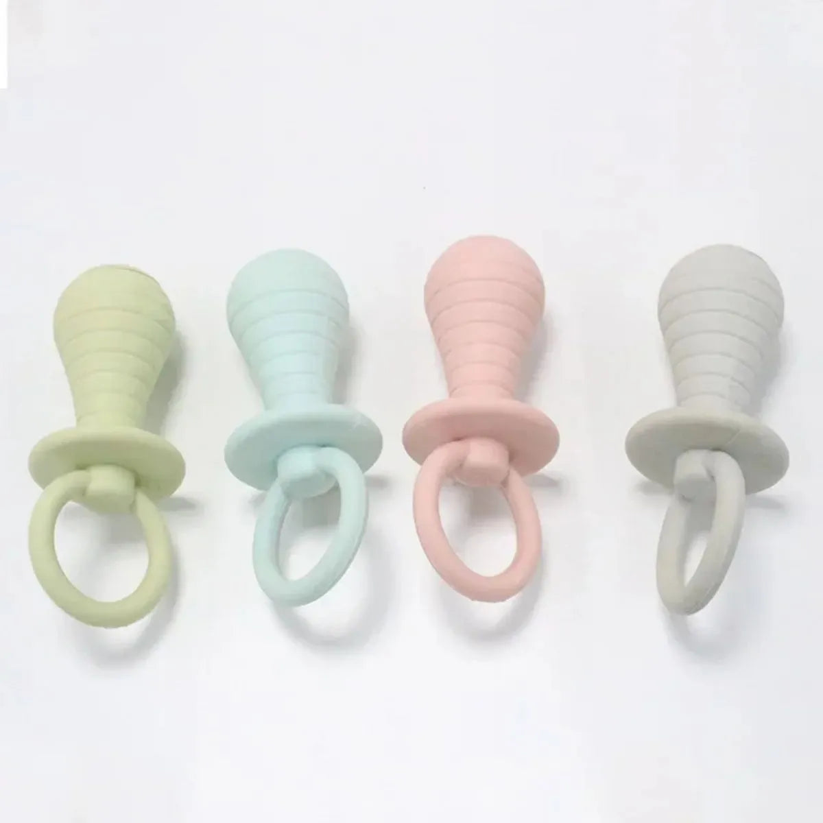 TPR pet pacifier squeaker toys for puppies and kittens in blue, grey, green, and pink colours