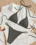 Women's white lace up bikini swimsuit with adjustable front on mannequin
