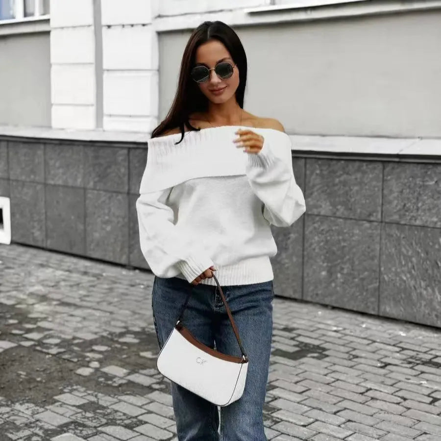 Grey off-the-shoulder strapless sweater with a 3D textured pattern, shown on a model.