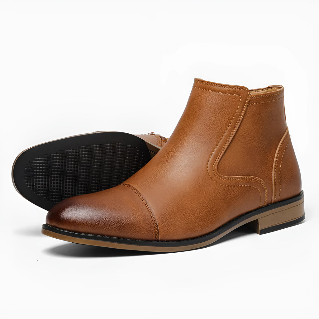 Men's brown Chelsea boot with side zipper, round toe, low heel, and wooden sole.