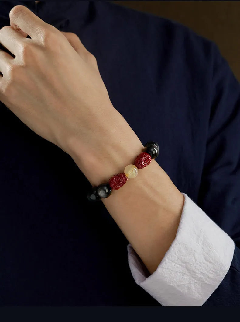 Cinnabar beads bracelet with animal zodiac modelling in gold obsidian or silver stone options presented in silver gift box
