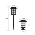 Black solar-powered LED lawn light for outdoor garden and pathway illumination with waterproof construction