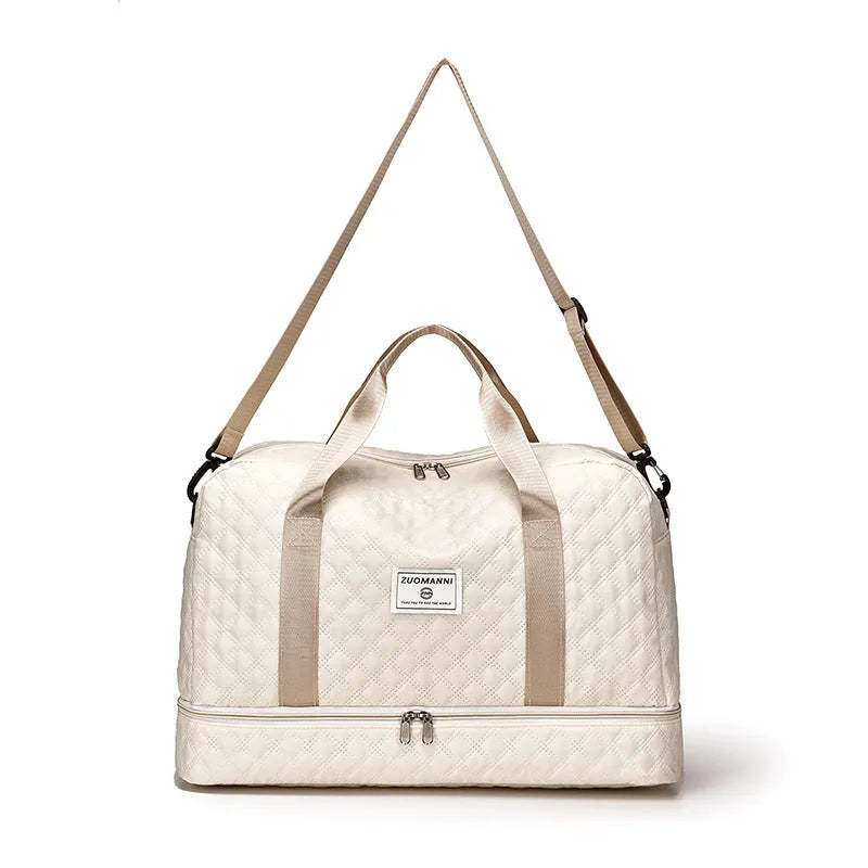 Large 55-litre buggy style travel bag in Oxford cloth, shown in a solid colour with shoulder straps.