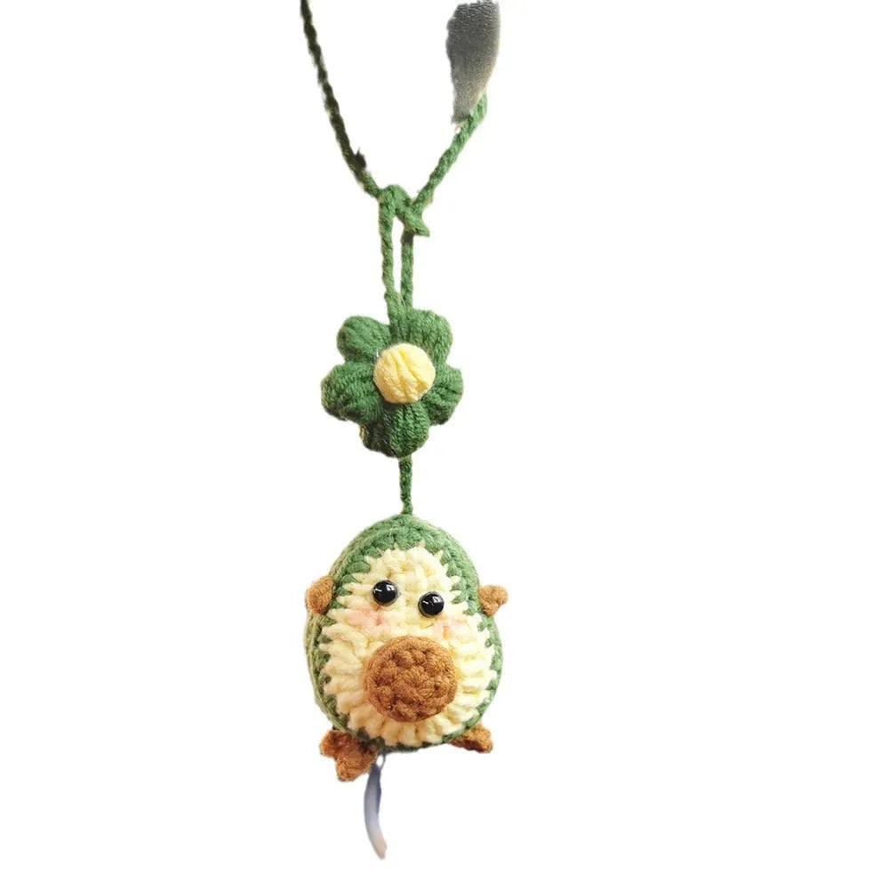 Handmade crocheted avocado rainbow flower car pendant made from wool yarn.
