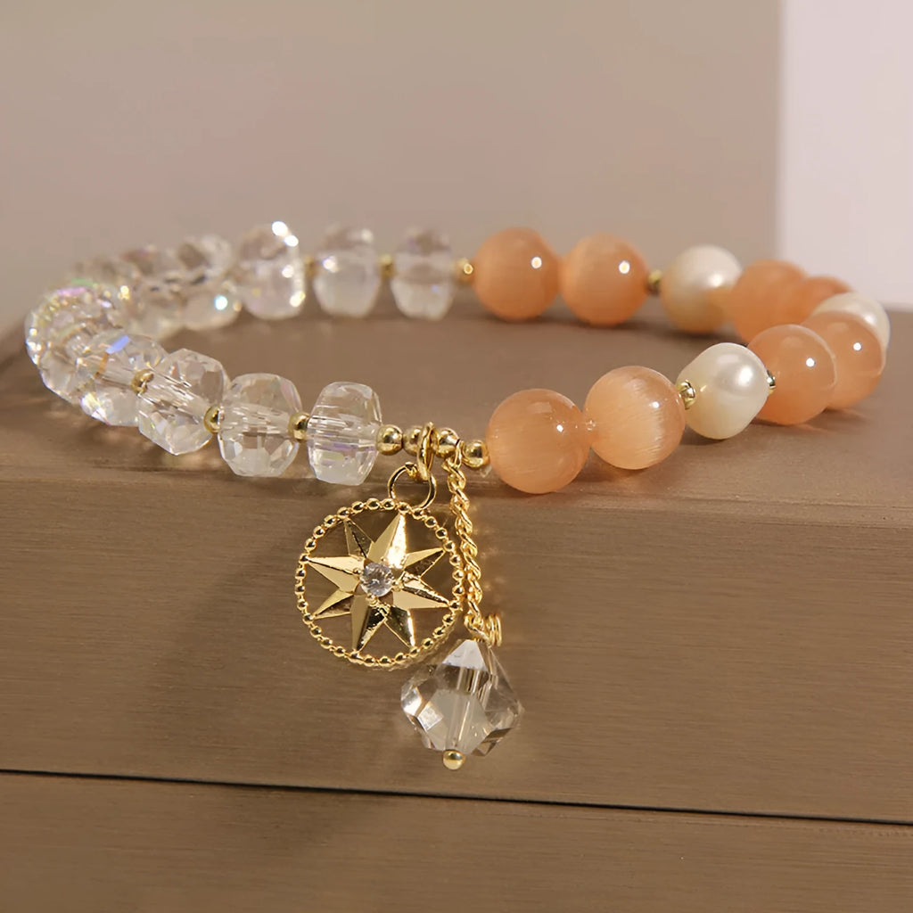 Orange opal crystal bracelet with gold-plated eight awn star design and artificial gemstone inlay
