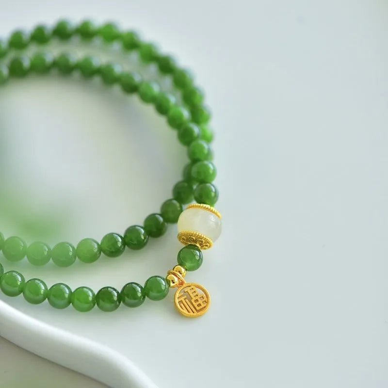 Double circle Hetian jade bracelet with geometric design and fu character elements