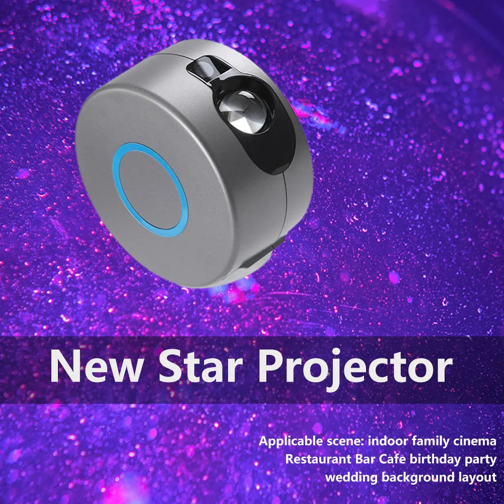 Grey starry sky projection lamp with remote control on a table, projecting light onto a ceiling.