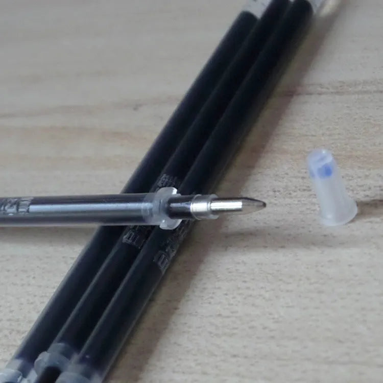 Automatic fade and disappear pen set showing pen holder, case, and eight refills