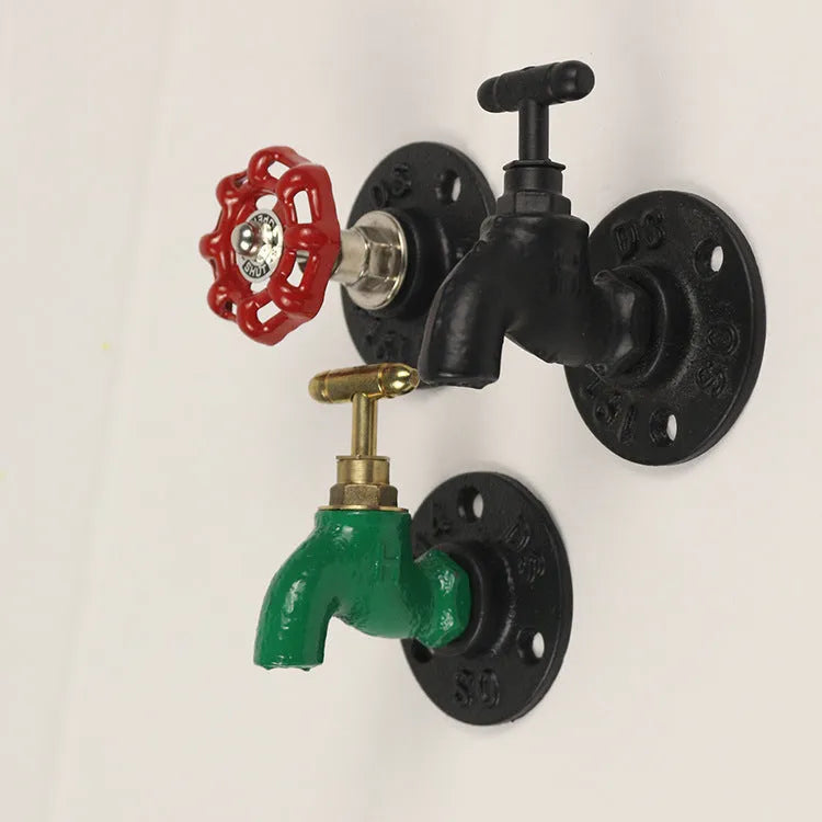 Metal water pipe style towel rack hook with polished chrome finish mounted on wall