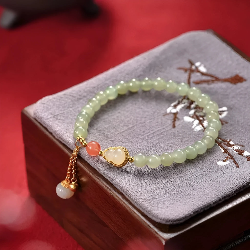 Qingshui jade women's bracelet with gold-plated gourd charm and fu character