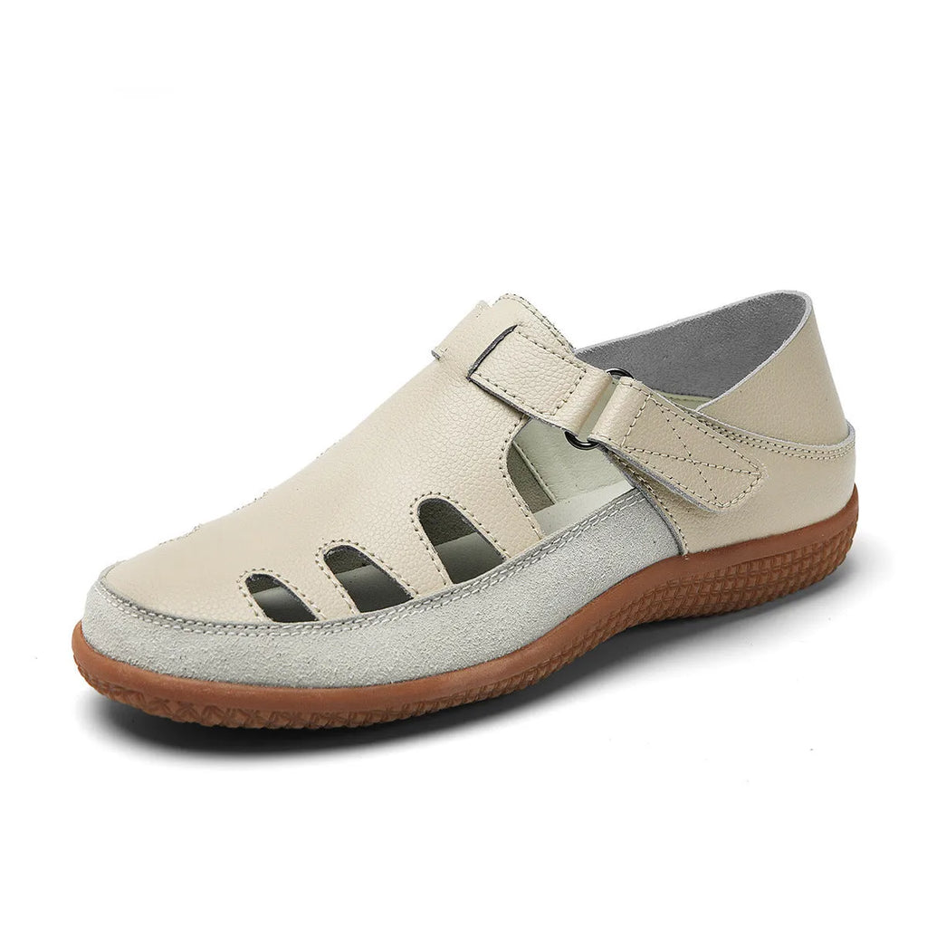 Plus size white women's sandals with hollow toe design and thick flat rubber sole.