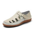 Plus size white women's sandals with hollow toe design and thick flat rubber sole.