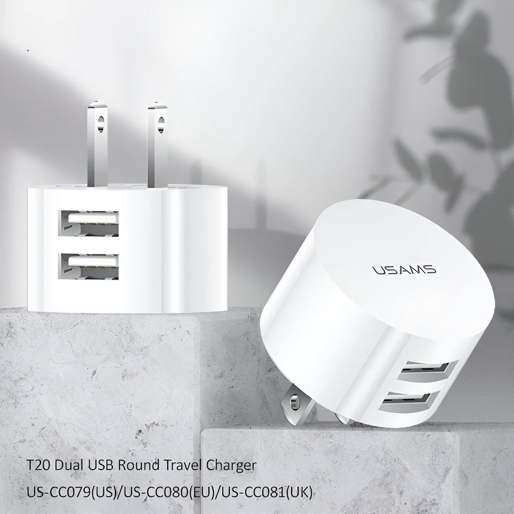 White portable dual USB charger with folding UK, US, and EU plugs showing compact dimensions
