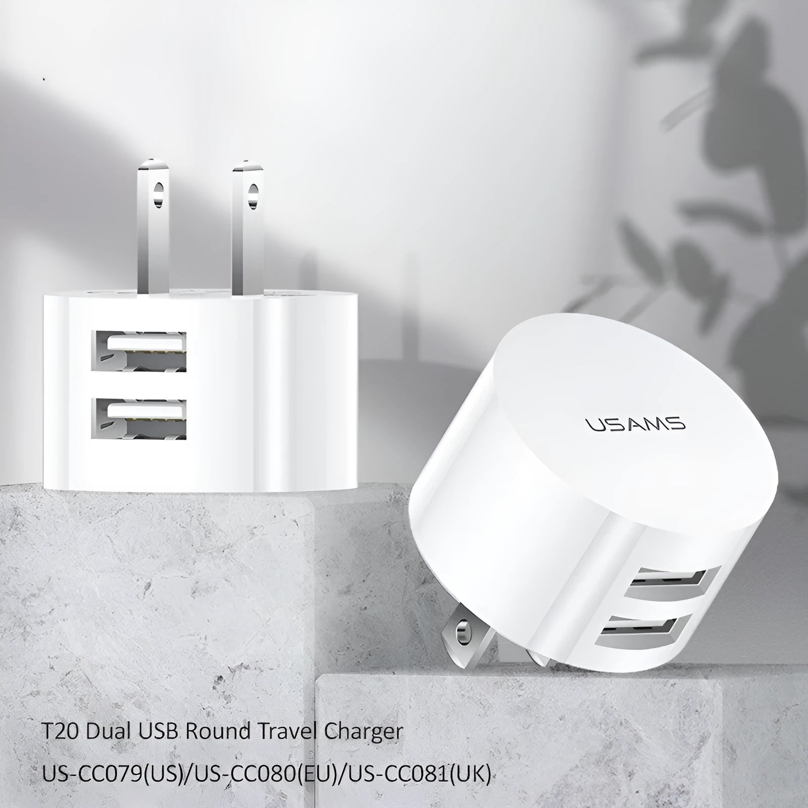 White portable dual USB charger with folding UK, US, and EU plugs showing compact dimensions