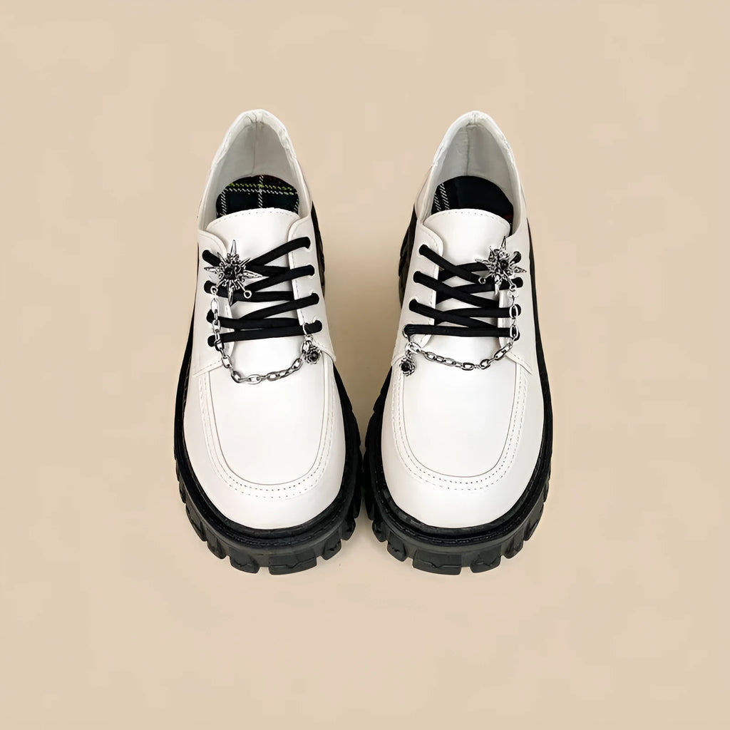 Women's Duke Asterism coloured loafers with a metal cross-strap and round toe in a preppy style.