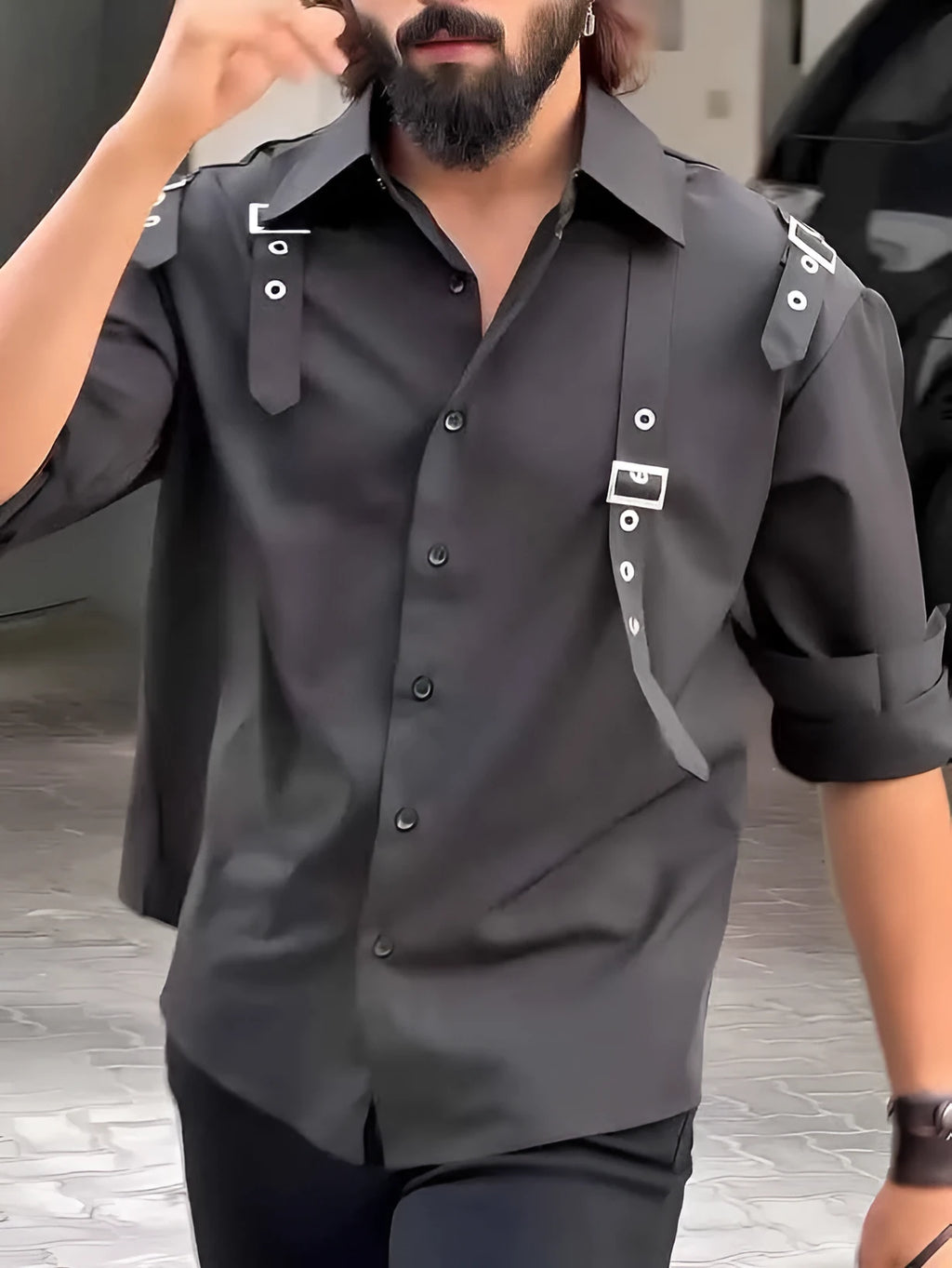 Men's black utility-style button-up shirt on a hanger, showing classic collar and button front.
