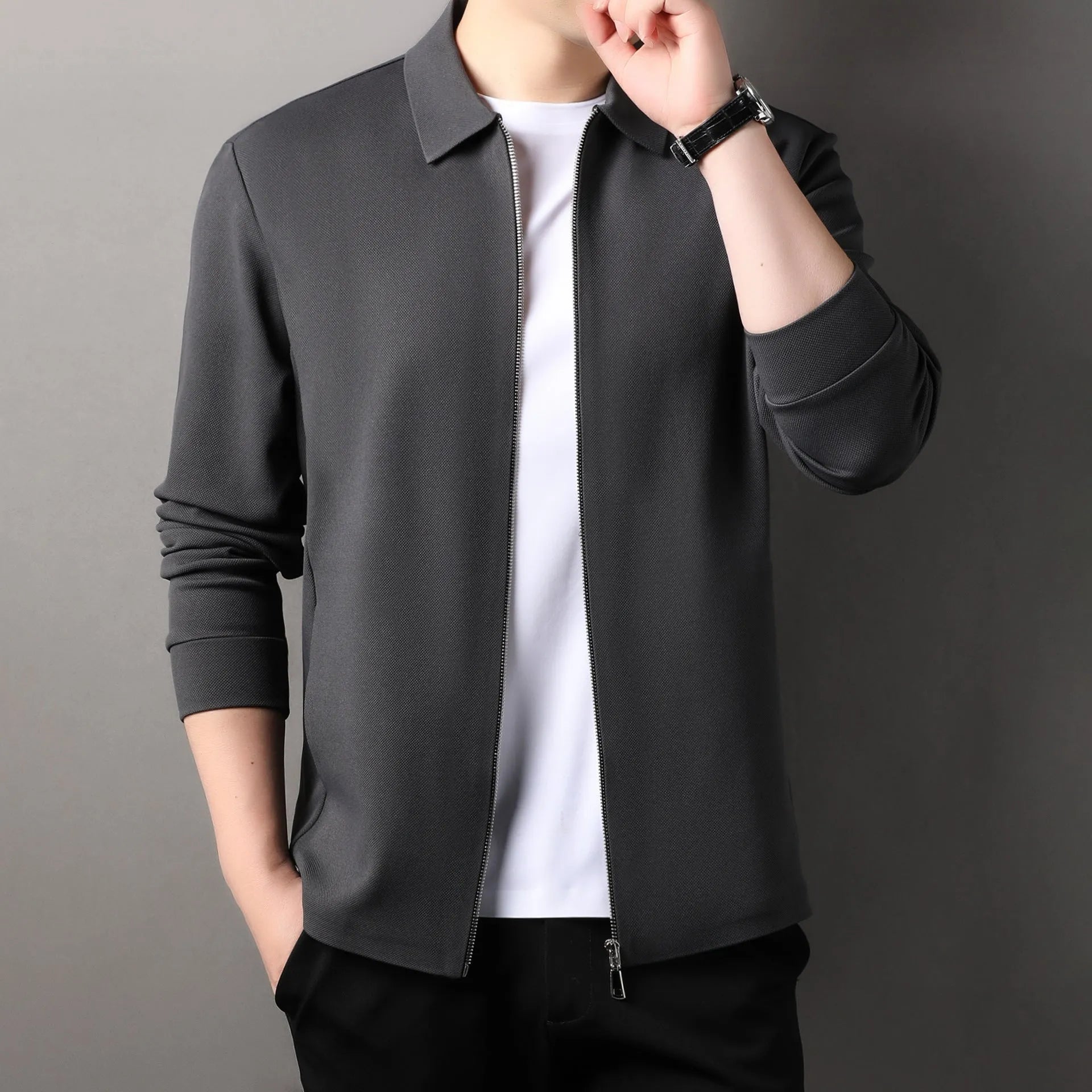 Men's straight hem polyester jacket in dark grey on a hanger.