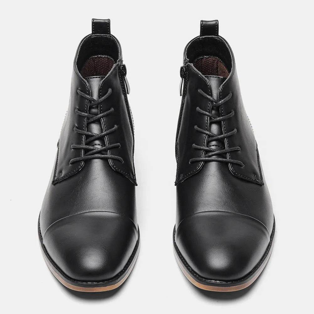 Men's brown Chelsea boot with side zipper, round toe, low heel, and wooden sole.