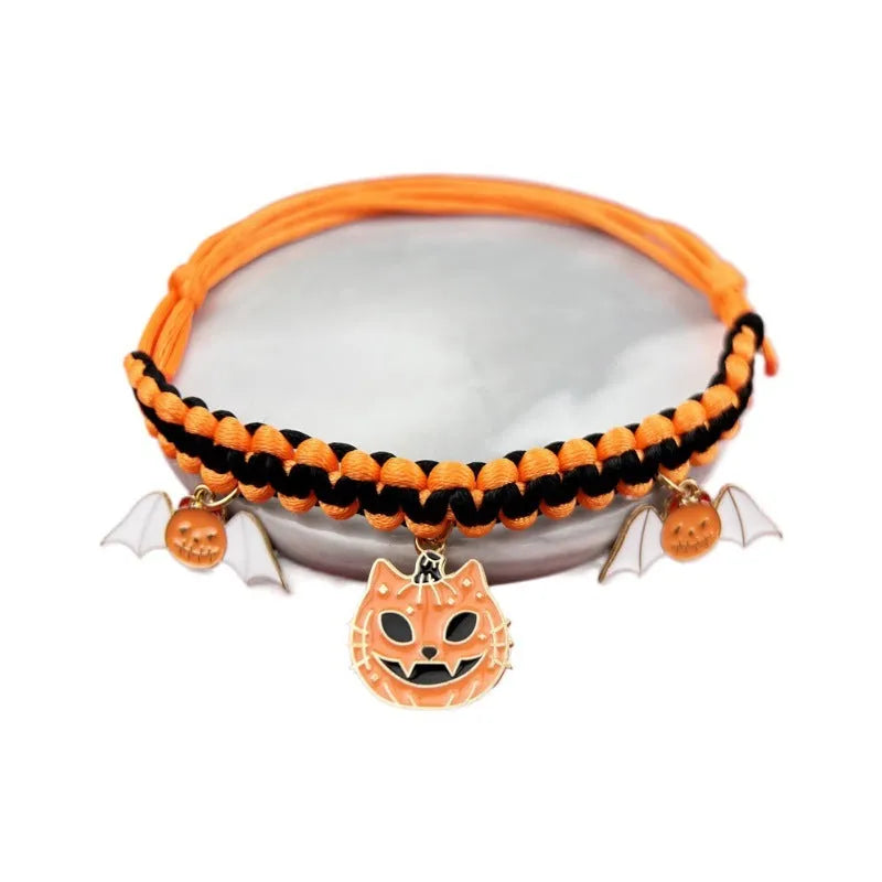 Zinc alloy Halloween charm on a pet collar, showing geometric pattern and clip.