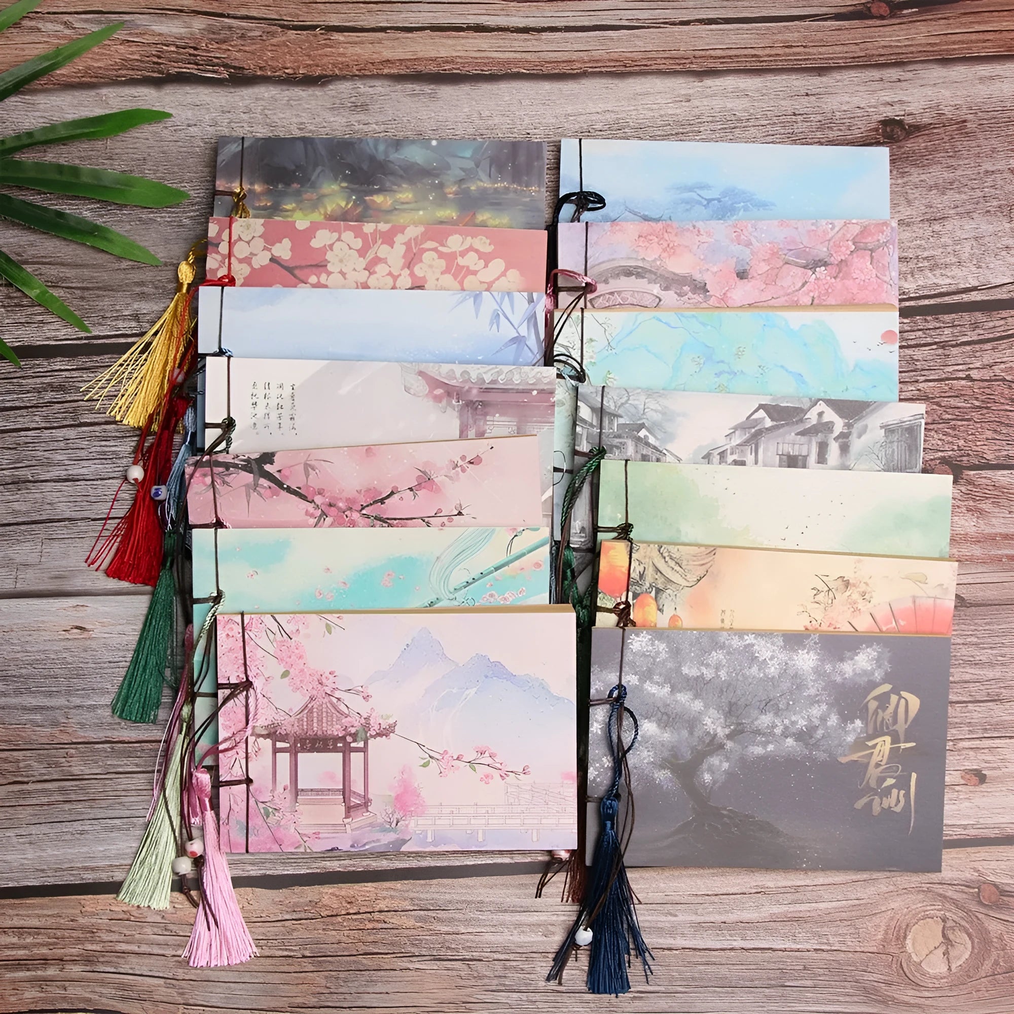 Hand-stitched kraft paper blank notebook with a tassel bookmark on a 12 by 14.5 cm page.