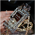 Perfume bottle bow design iPhone case with a metal chain strap in black, gold, pink, or transparent colours.