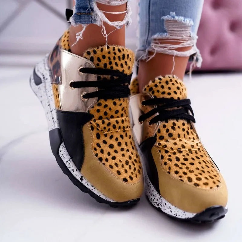 Women's casual suede sneakers with a wedge heel in black, leopard, pink, panther, and snake pattern colours.