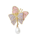 Vintage enamel butterfly brooch with pearl accents on alloy base