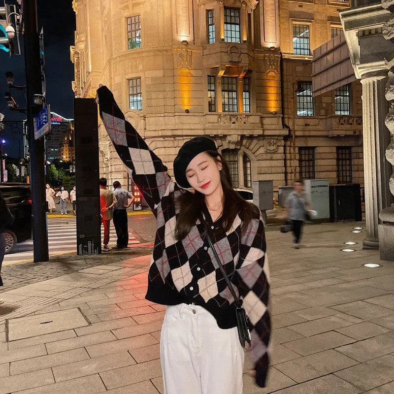 A casual knitted acrylic cardigan coat in a macaron colour, shown in a regular fit with regular sleeves.
