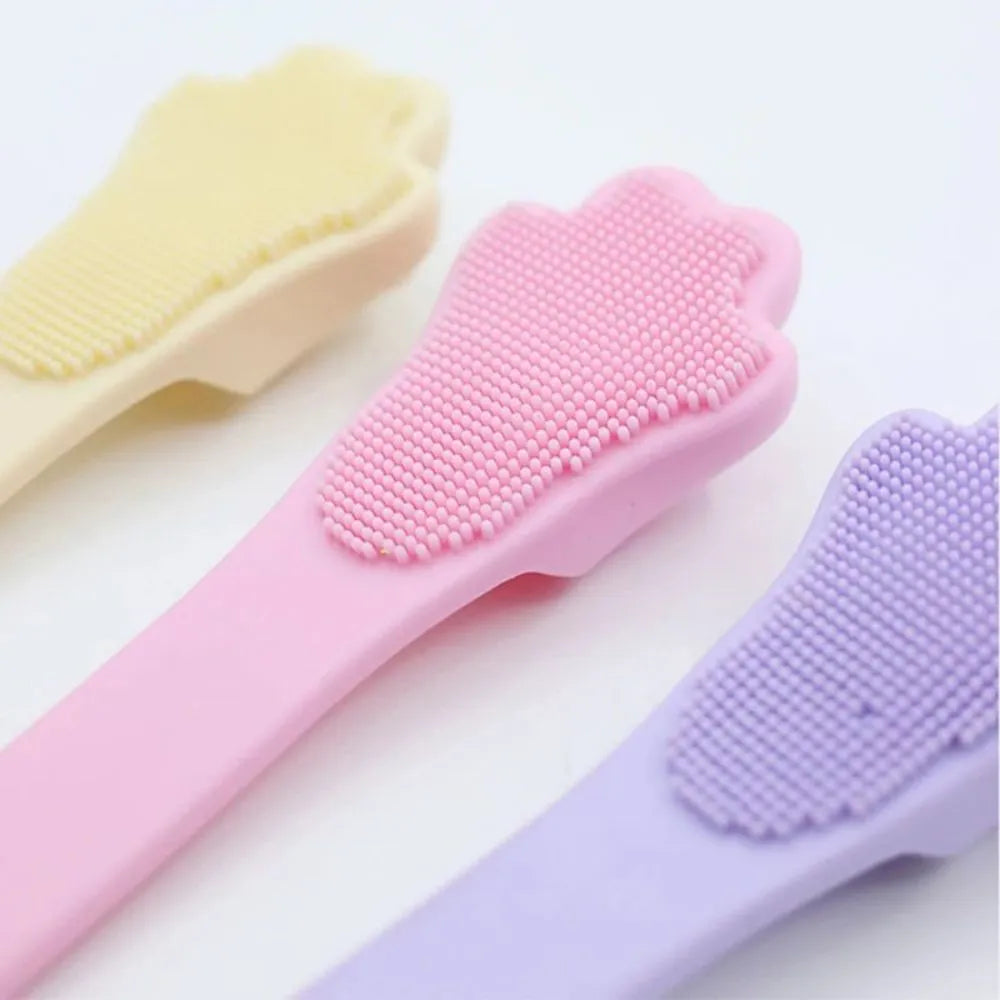 Pink silicone finger toothbrush for dogs and cats with soft nubby bristles.